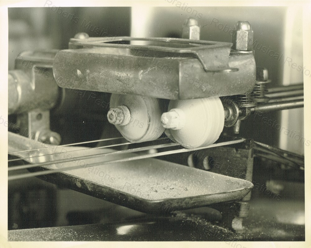 Mills Violano bow wheels and bow assembly detail during restoration